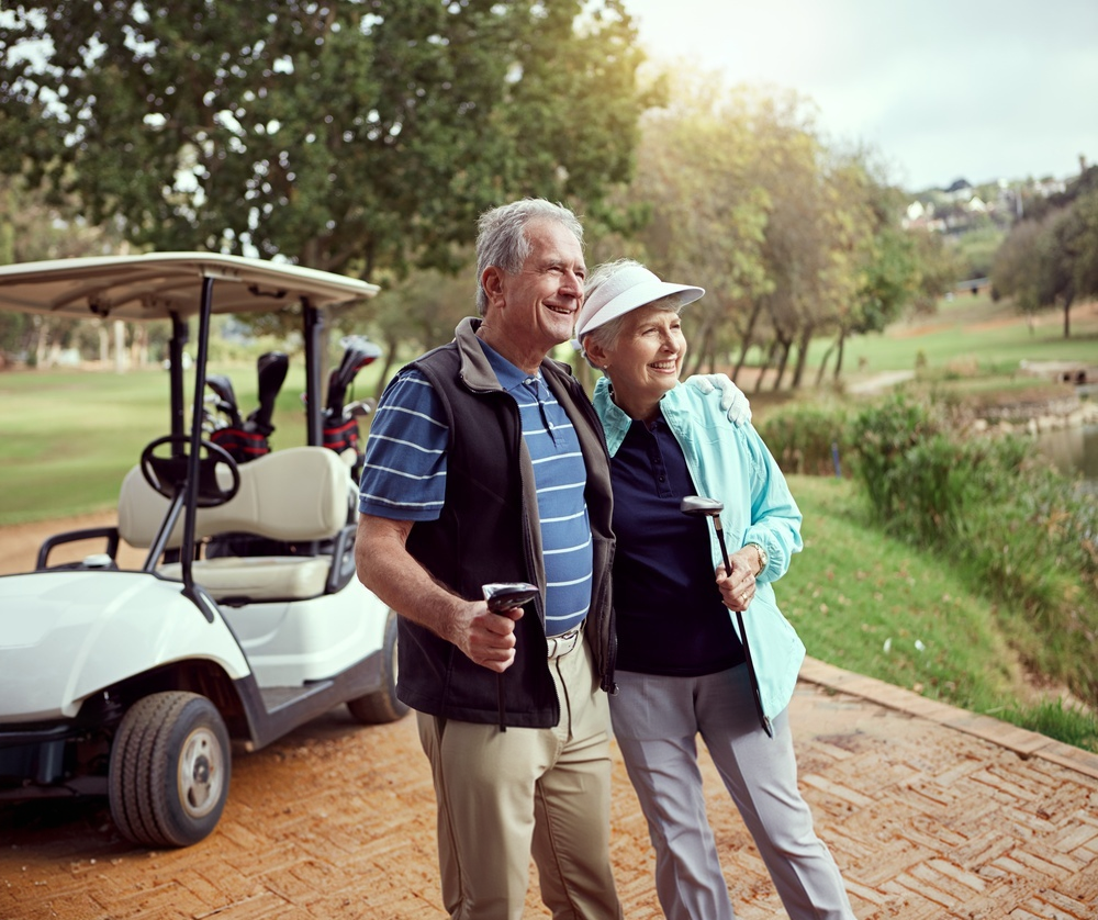 Affluent over-50s couple on a golf course